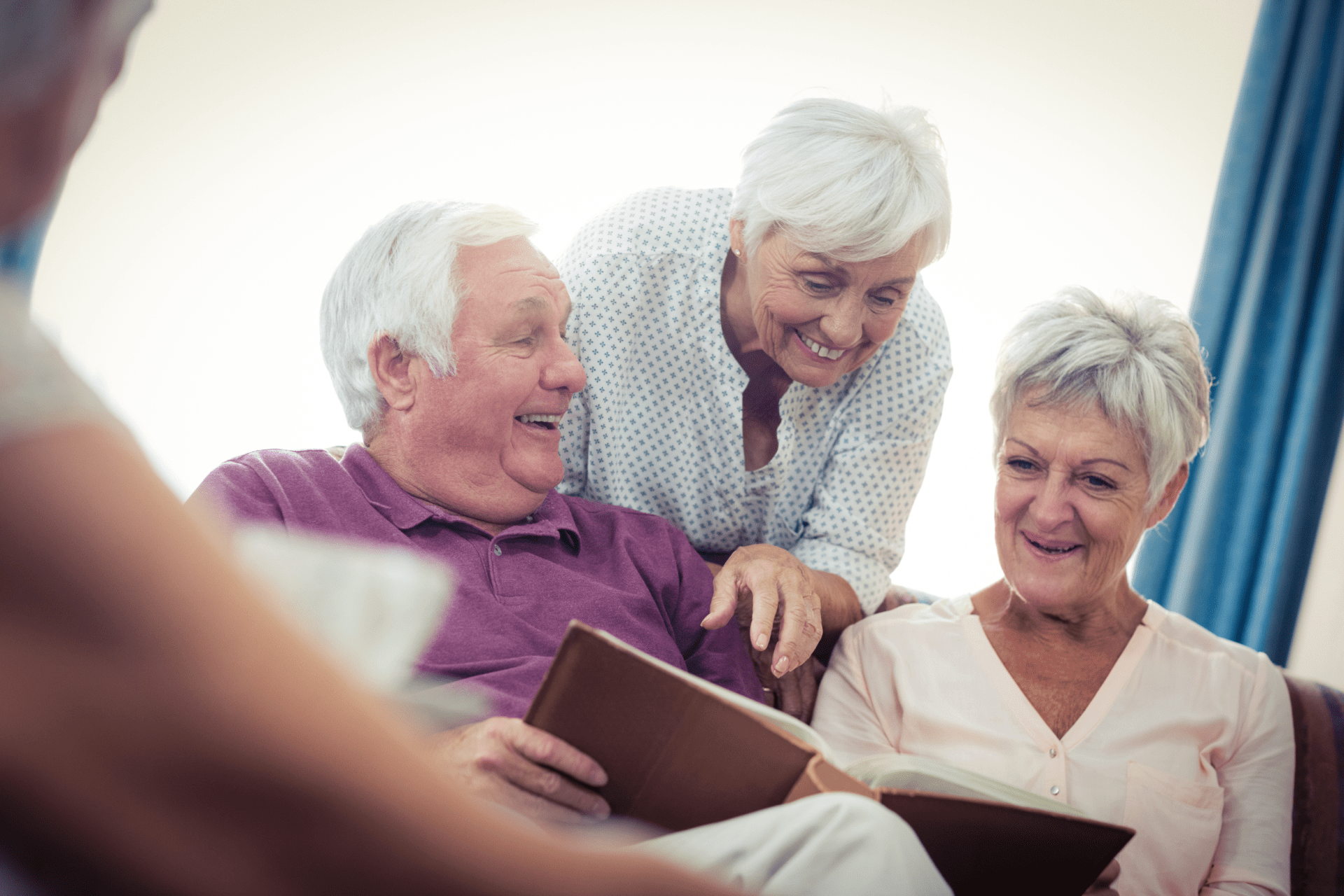 Seniors looking at pictures in the retirement house